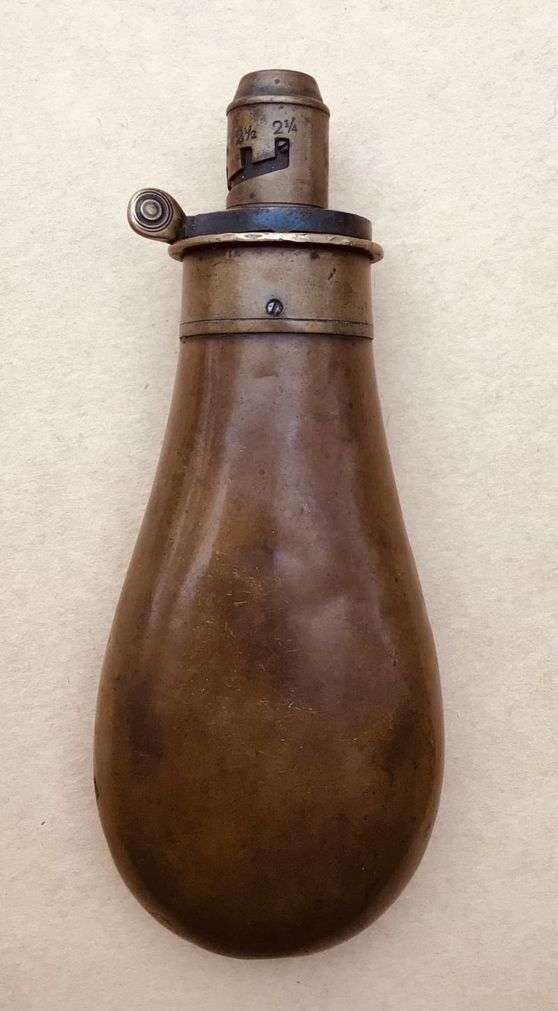 An Antique Brass Powder Flask