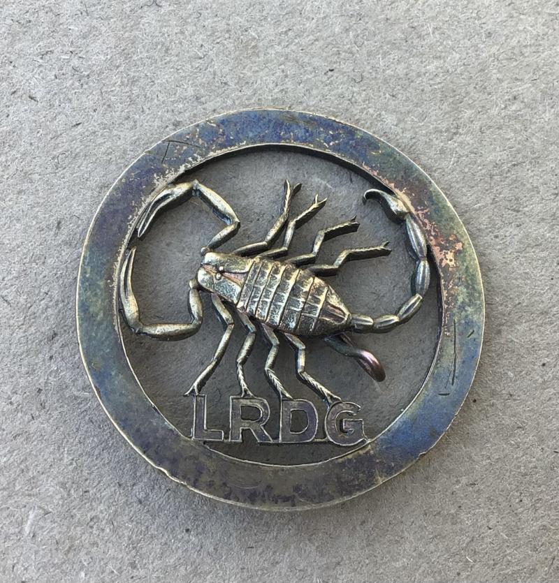 British WW2 Long Range Desert Group Hat Badge.